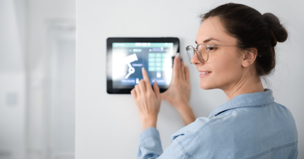 woman using home security system that she purchased after thorough research
