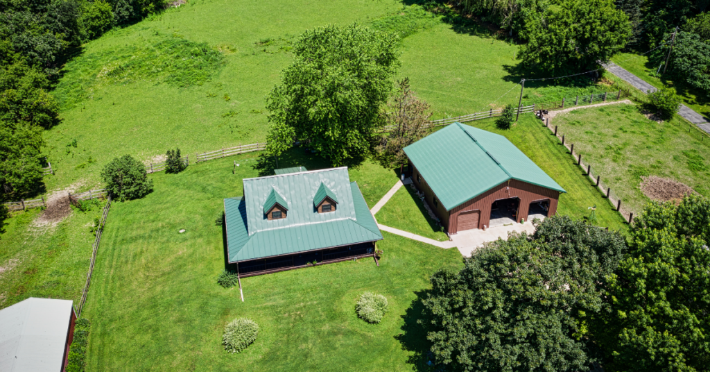An aerial view of a large rural property with multiple buildings.